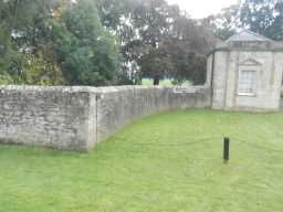 Second oblique view of wall connected to West Lodge at Streathlam Castle October 2016
